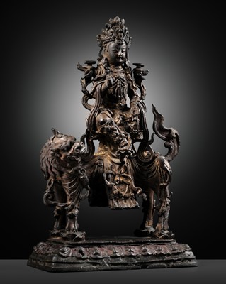 Lot 50 - A GILT LACQUERED BRONZE FIGURE OF WENSHU (MANJUSHRI) ON A LION, MING DYNASTY