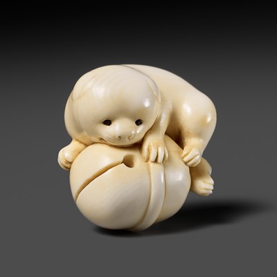 Lot 95 - MIYAGI CHOKUSAI: AN IVORY NETSUKE OF A PUPPY PLAYING WITH A BELL