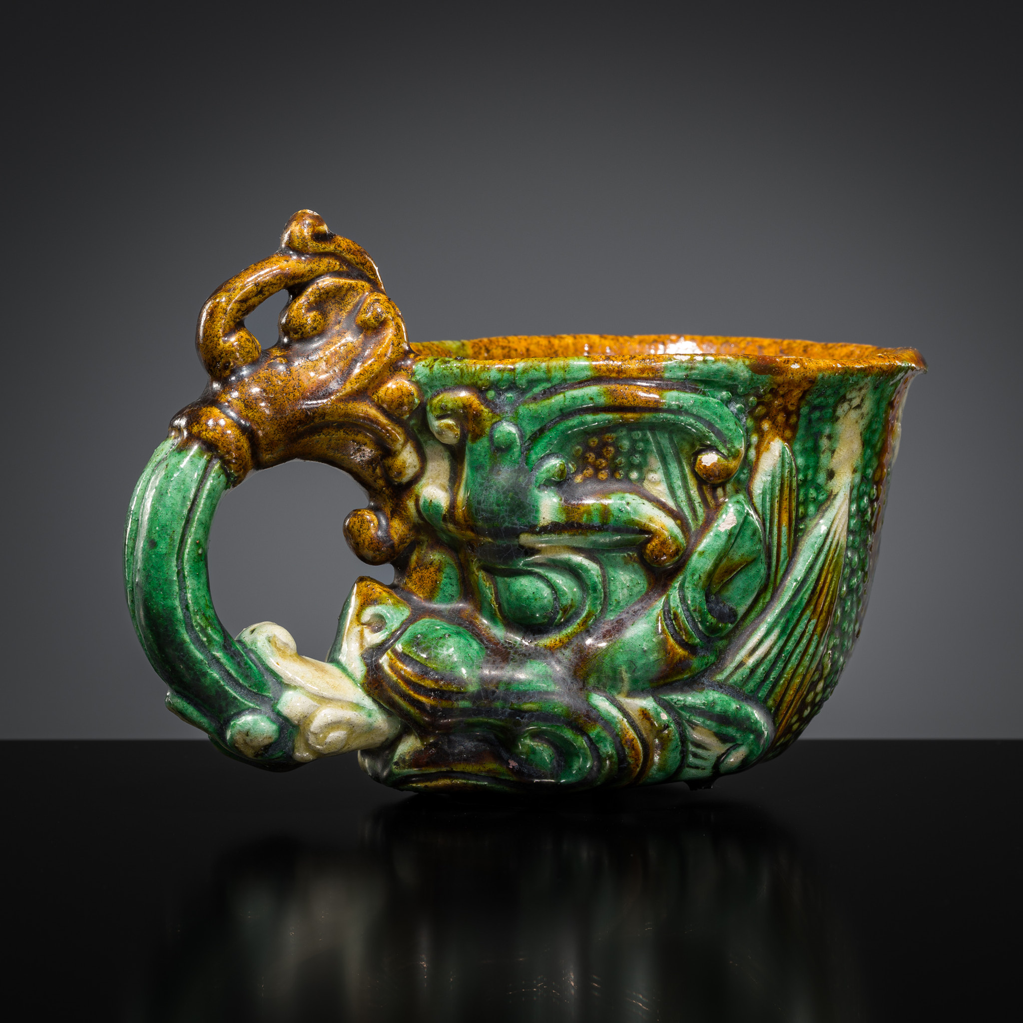 Lot 536 - A RARE SANCAI-GLAZED POTTERY RHYTON, TANG