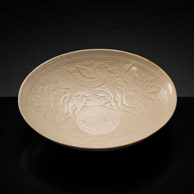 Lot 545 - A MOLDED DINGYAO ‘LOTUS POND’ DISH, NORTHERN SONG DYNASTY