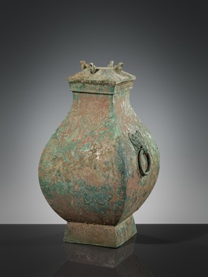 Lot 71 - A BRONZE STORAGE VESSEL AND COVER WITH BIRD-FORM FINIALS, FANGHU, HAN DYNASTY