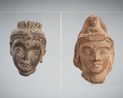 Lot 1243 - A PAIR OF SCHIST AND TERRACOTTA HEADS OF BUDDHA, ANCIENT REGION OF GANDHARA