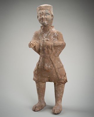 A POTTERY TOMB FIGURE OF A FARMER