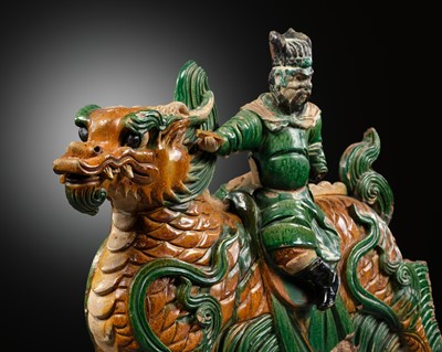 A MASSIVE IMPERIAL SANCAI GLAZED ‘DRAGON AND IMMORTAL RIDER’ ROOF TILE, MING DYNASTY