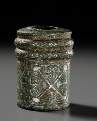 Lot 66 - A SILVER INLAID BRONZE CHARIOT AXLE CAP, WARRING STATES TO HAN DYNASTY