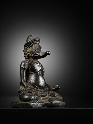 Lot 265 - A FINE BRONZE FIGURE OF GANESHA, KHMER EMPIRE, ANGKOR WAT STYLE