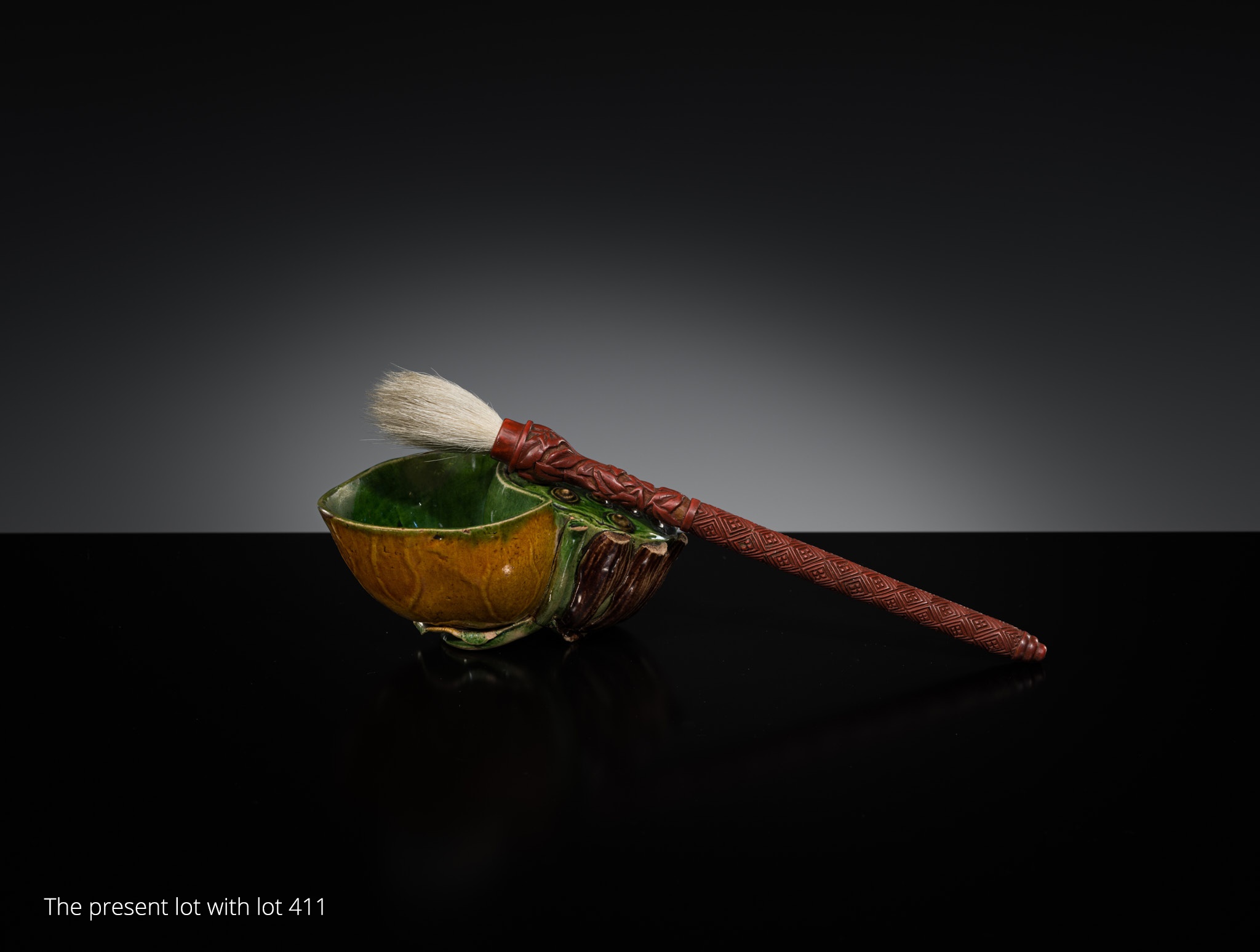 Lot 557 - A FAMILLE VERTE BISCUIT LOTUS-FORM WATER