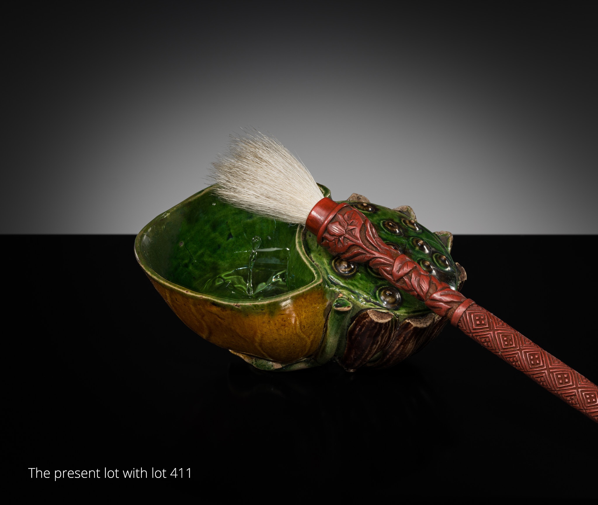 Lot 557 - A FAMILLE VERTE BISCUIT LOTUS-FORM WATER