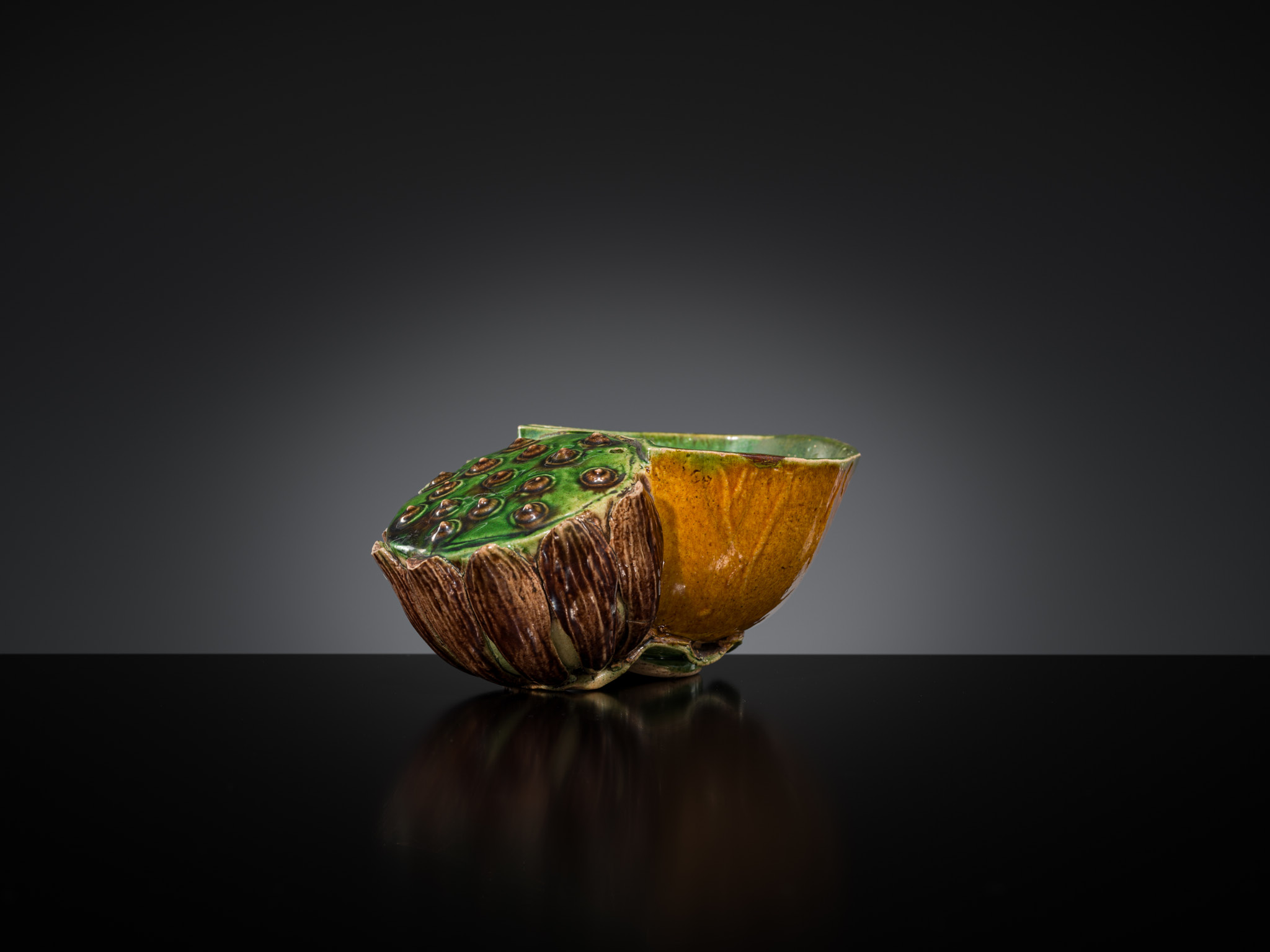 Lot 557 - A FAMILLE VERTE BISCUIT LOTUS-FORM WATER