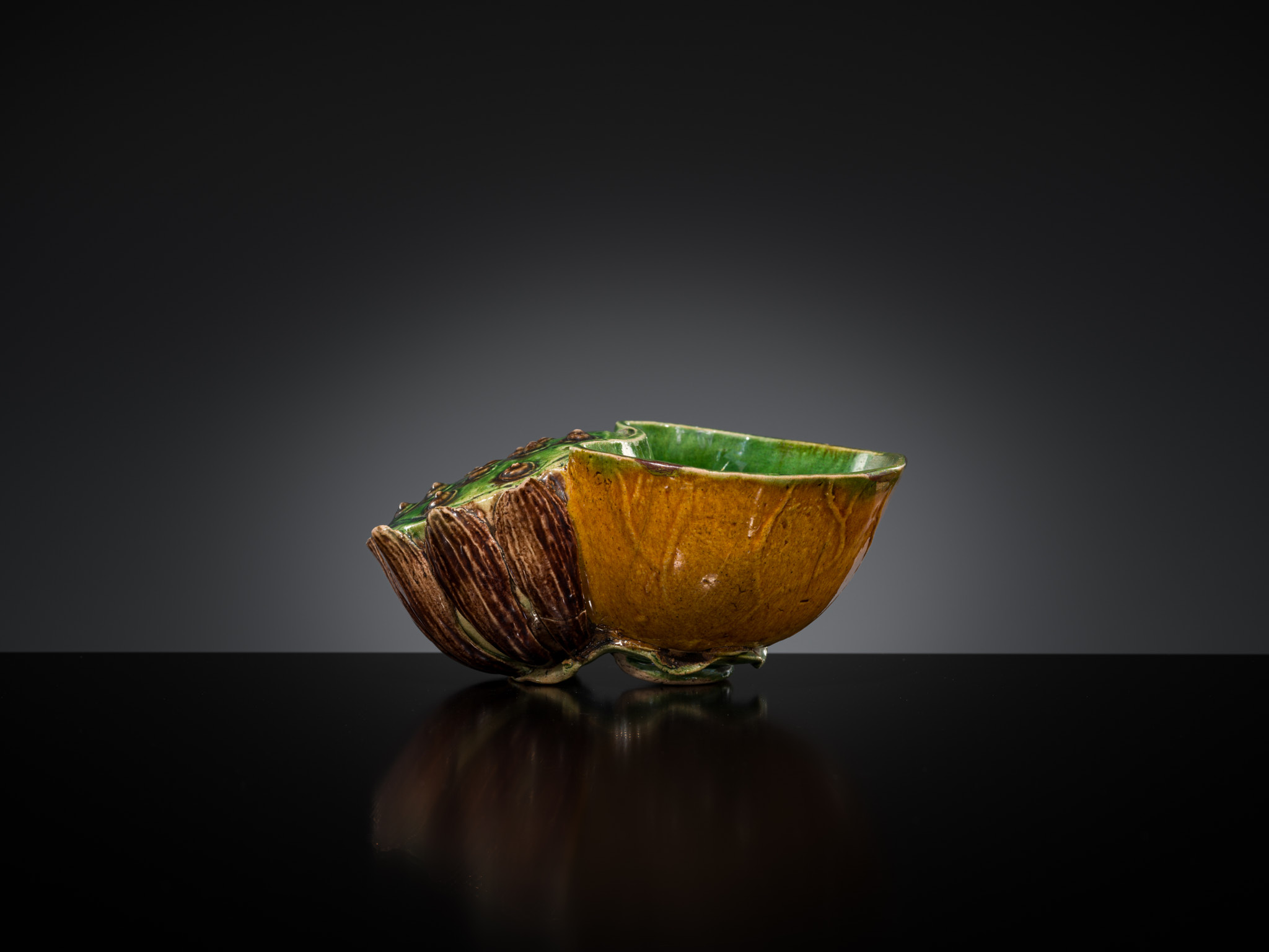 Lot 557 - A FAMILLE VERTE BISCUIT LOTUS-FORM WATER