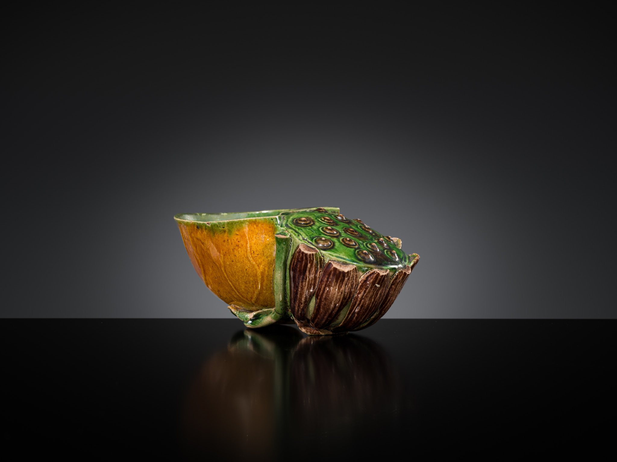 Lot 557 - A FAMILLE VERTE BISCUIT LOTUS-FORM WATER