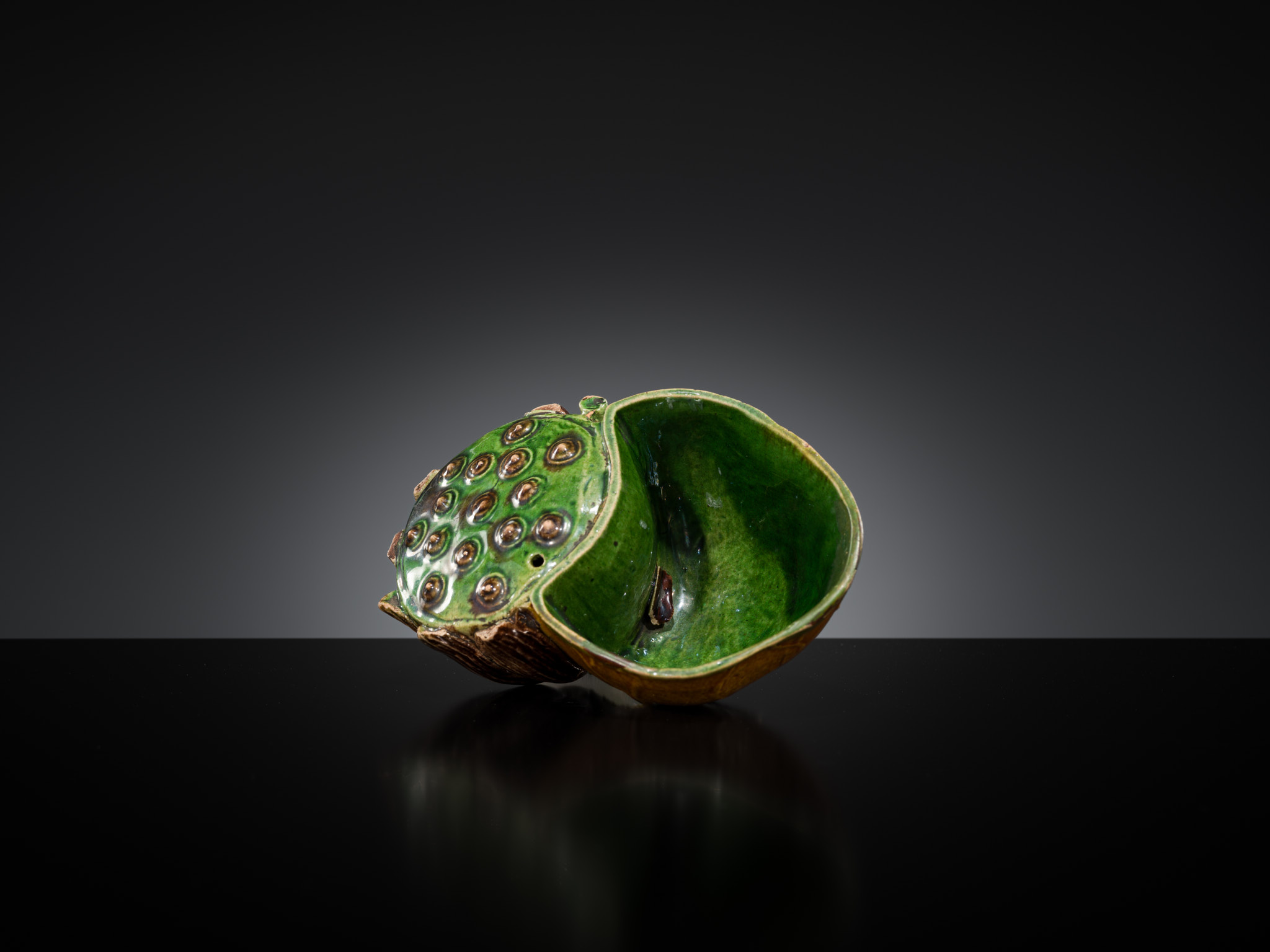 Lot 557 - A FAMILLE VERTE BISCUIT LOTUS-FORM WATER