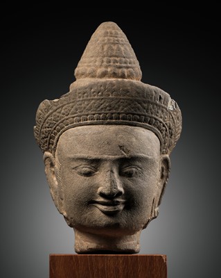 Lot 680 - A SANDSTONE HEAD OF A MALE DEITY, ANGKOR PERIOD