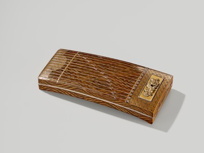 Lot 118 - A FINE LACQUER SUZURIBAKO (WRITING BOX) IN THE FORM OF A KOTO (HARP)