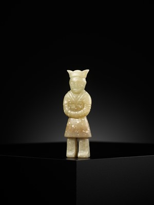 A YELLOW JADE ‘MALE ATTENDANT’ PENDANT, WARRING STATES PERIOD