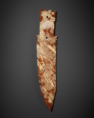 Lot 141 - A LARGE ARCHAIC IVORY AND RUSSET JADE CEREMONIAL BLADE, GE, SHANG PERIOD