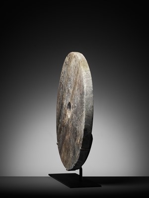 Lot 134 - A VERY LARGE MOTTLED GRAY JADE DISC, BI, LIANGZHU CULTURE