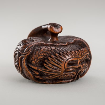 Lot 336 - SADANOBU: A WOOD NETSUKE OF A DRAGON IN A MIKAN