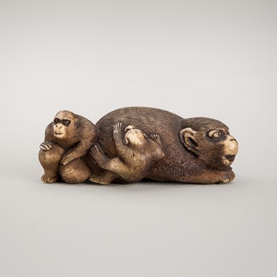 Lot 1266 - AN ANTLER NETSUKE OF A MONKEY WITH YOUNGS