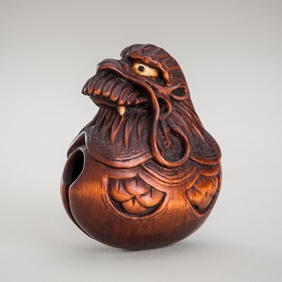 Lot 1352 - AN INLAID WOOD NETSUKE OF A MOKUGYO