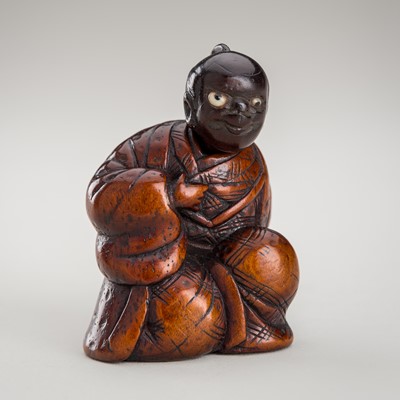 Lot 459 - A KARAKURI (TRICK) WOOD NETSUKE OF A DRUNKARD