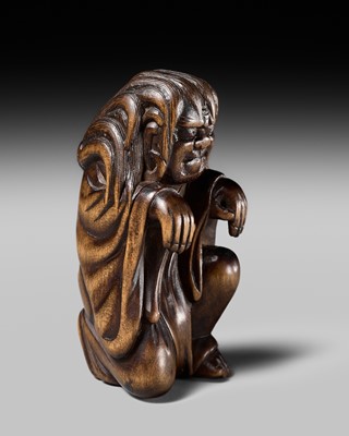 Lot 108 - A VERY RARE WOOD NETSUKE OF DARUMA IMITATING A GHOST