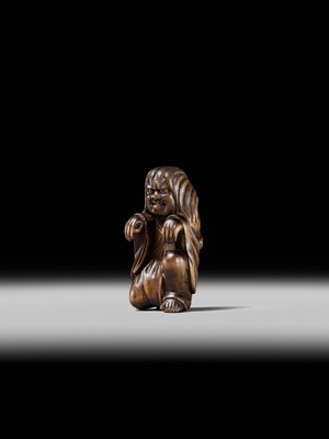 Lot 108 - A VERY RARE WOOD NETSUKE OF DARUMA IMITATING A GHOST