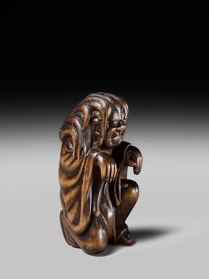 Lot 108 - A VERY RARE WOOD NETSUKE OF DARUMA IMITATING A GHOST