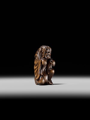 Lot 108 - A VERY RARE WOOD NETSUKE OF DARUMA IMITATING A GHOST