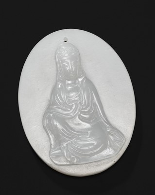 A WHITE JADE ‘GUANYIN’ PENDANT, LATE QING DYNASTY TO REPUBLIC PERIOD