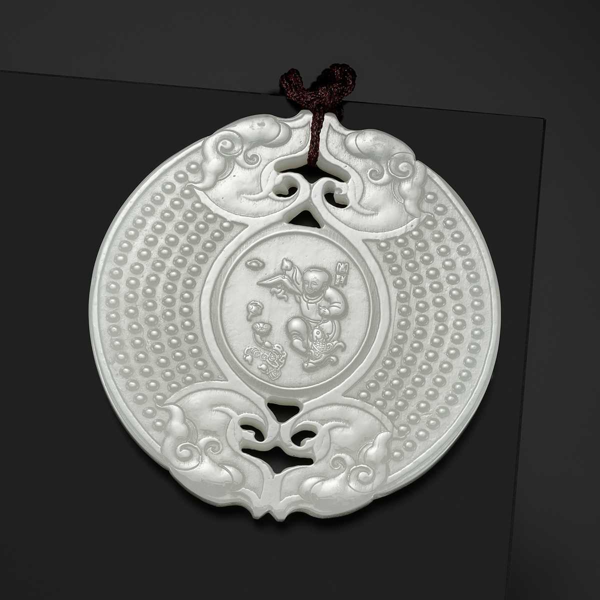 Lot 978 - A WHITE JADE ‘HUANG’ PLAQUE, LATE QING DYNASTY TO REPUBLIC PERIOD