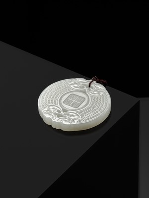 Lot 978 - A WHITE JADE ‘HUANG’ PLAQUE, LATE QING DYNASTY TO REPUBLIC PERIOD