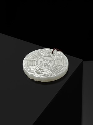 Lot 978 - A WHITE JADE ‘HUANG’ PLAQUE, LATE QING DYNASTY TO REPUBLIC PERIOD