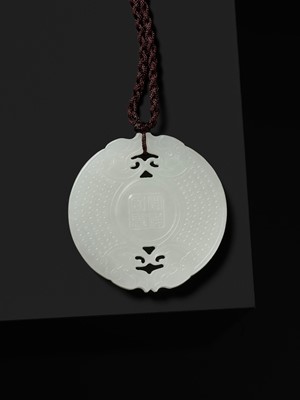 Lot 978 - A WHITE JADE ‘HUANG’ PLAQUE, LATE QING DYNASTY TO REPUBLIC PERIOD