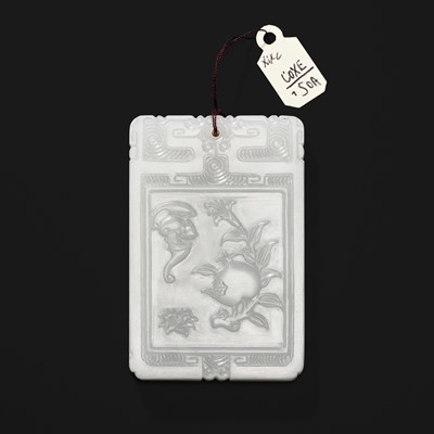 A WHITE JADE ‘BAT AND POMEGRANATE’ PLAQUE, 19TH CENTURY