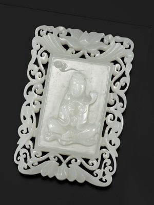 Lot 980 - A RETICULATED WHITE JADE ‘GUANYIN’ PLAQUE, LATE QING DYNASTY TO REPUBLIC PERIOD