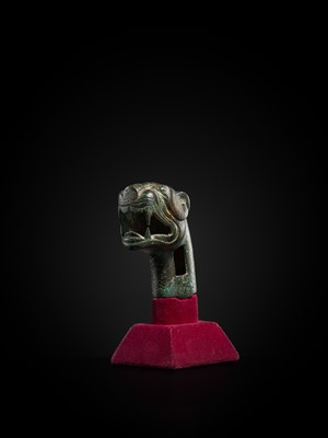 Lot 112 - A TURQUOIZE- AND SILVER-INLAID BRONZE ‘TIGER’ FINIAL, EASTERN HAN DYNASTY