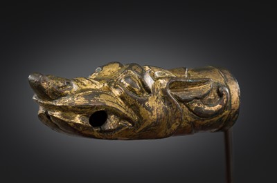 Lot 377 - A GILT BRONZE ‘DRAGON HEAD’ CHARIOT TERMINAL, HAN DYNASTY