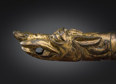 Lot 377 - A GILT BRONZE ‘DRAGON HEAD’ CHARIOT TERMINAL, HAN DYNASTY
