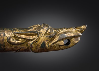 Lot 377 - A GILT BRONZE ‘DRAGON HEAD’ CHARIOT TERMINAL, HAN DYNASTY