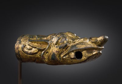 Lot 377 - A GILT BRONZE ‘DRAGON HEAD’ CHARIOT TERMINAL, HAN DYNASTY