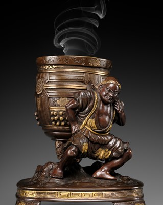 Lot 17 - MIYAO: A PARCEL-GILT BRONZE FIGURAL KORO (INCENSE BURNER) DEPICTING BENKEI HOLDING ALOFT THE MIIDERA TEMPLE BELL