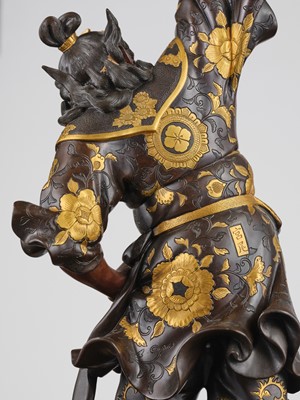 Lot 15 - MIYAO: A LARGE AND IMPRESSIVE PARCEL-GILT BRONZE STATUE OF A WARRIOR HOLDING ALOFT A KORO