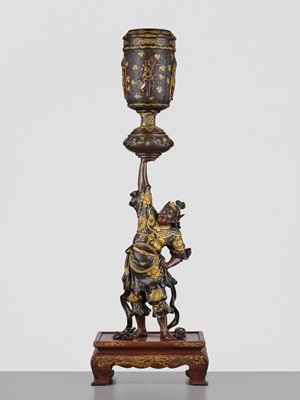 Lot 15 - MIYAO: A LARGE AND IMPRESSIVE PARCEL-GILT BRONZE STATUE OF A WARRIOR HOLDING ALOFT A KORO