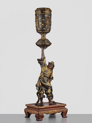 Lot 15 - MIYAO: A LARGE AND IMPRESSIVE PARCEL-GILT BRONZE STATUE OF A WARRIOR HOLDING ALOFT A KORO