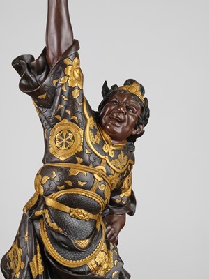 Lot 15 - MIYAO: A LARGE AND IMPRESSIVE PARCEL-GILT BRONZE STATUE OF A WARRIOR HOLDING ALOFT A KORO