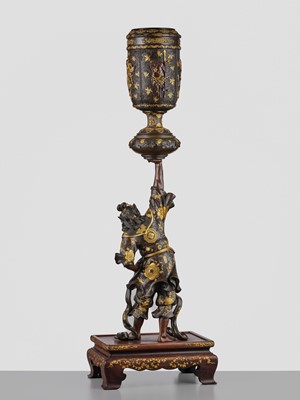 Lot 15 - MIYAO: A LARGE AND IMPRESSIVE PARCEL-GILT BRONZE STATUE OF A WARRIOR HOLDING ALOFT A KORO