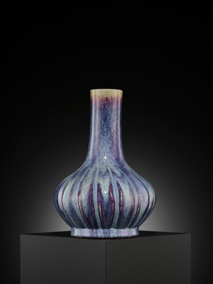 Lot 159 - A FLAMBÉ-GLAZED LOBED BOTTLE VASE, 18TH CENTURY