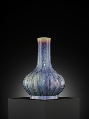Lot 159 - A FLAMBÉ-GLAZED LOBED BOTTLE VASE, 18TH CENTURY