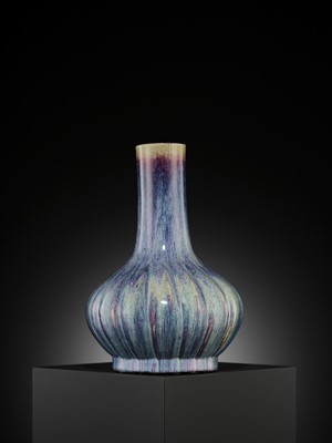 Lot 159 - A FLAMBÉ-GLAZED LOBED BOTTLE VASE, 18TH CENTURY